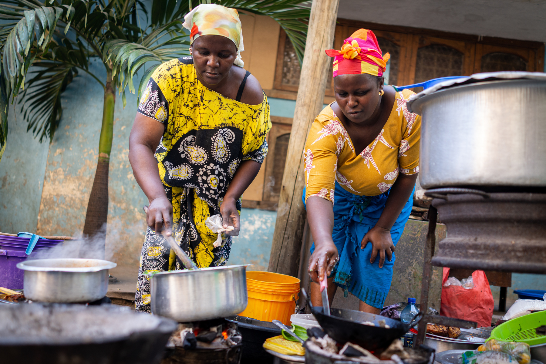 African Woman Cooking Traditional Food on Street